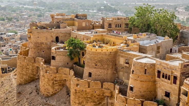 "Jaisalmer Fort in Rajasthan glowing at sunset with sandstone architecture"
